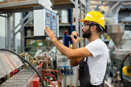 worker on sheet metal machine line